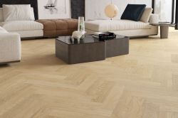 oak effect herringbone laminate flooring in a modern living room
